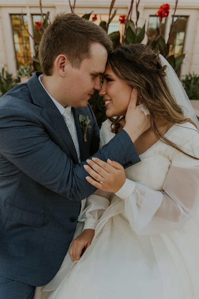 Intimate bridal portrait of bride and groom at Mesa Arizona temple. Mesa temple first look photos #ChelseyMichelleCoPhotography #Arizonaweddingphotographer #Phoenixphotographer #Mesaphotographer #Gilbertphotographer #ArizonaLDSwedding #MesaArizonaTemple