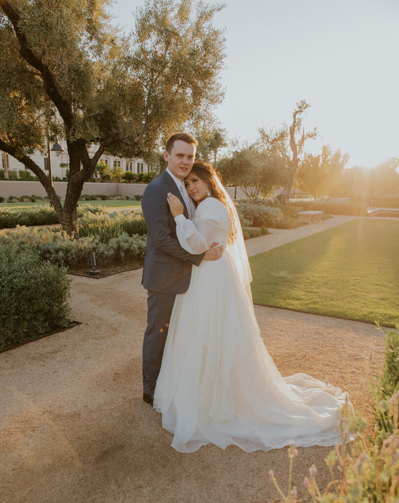 Formal bride and groom wedding photo at Mesa Arizona temple during golden hour. Wedding photo with lens flare #ChelseyMichelleCoPhotography #Arizonaweddingphotographer #Phoenixphotographer #Mesaphotographer #Gilbertphotographer #ArizonaLDSwedding #MesaArizonaTemple