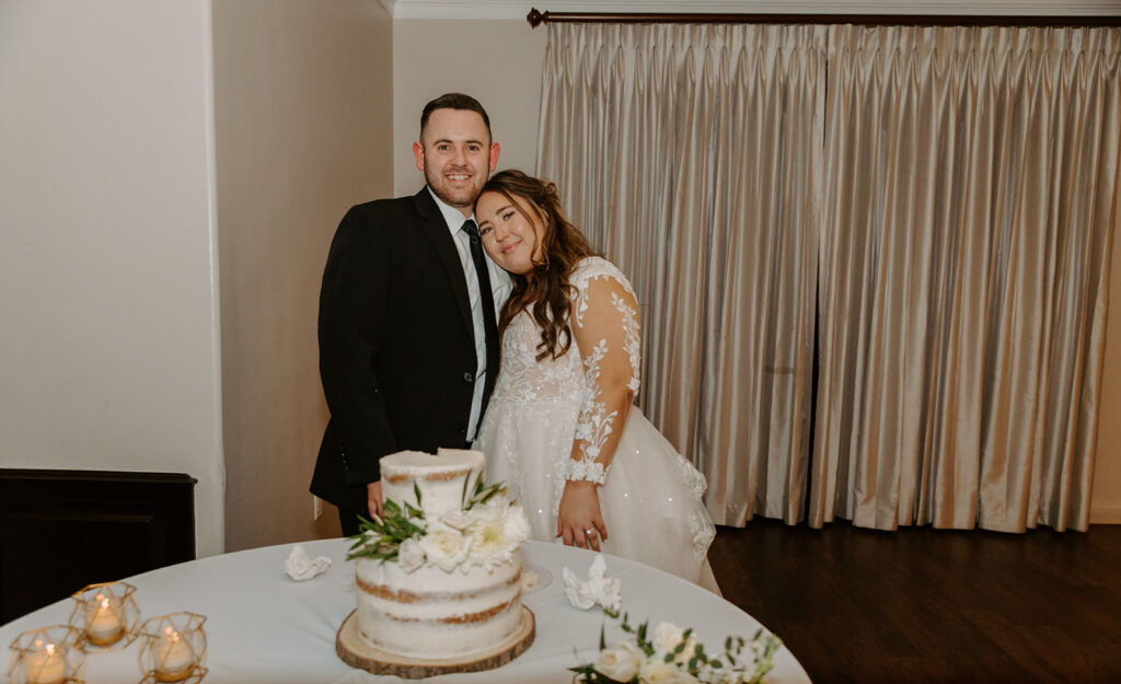 The bride and groom snuggle in for a sweet smiling picture after they have cut and eaten their wedding cake. Reception photos taken by Chelsey Michelle Co Photography.
#ChelseyMichelleCoPhotography #Arizonaweddingphotographer #Gilbertphotographer #GilbertLDSwedding #TemplePhotographer
