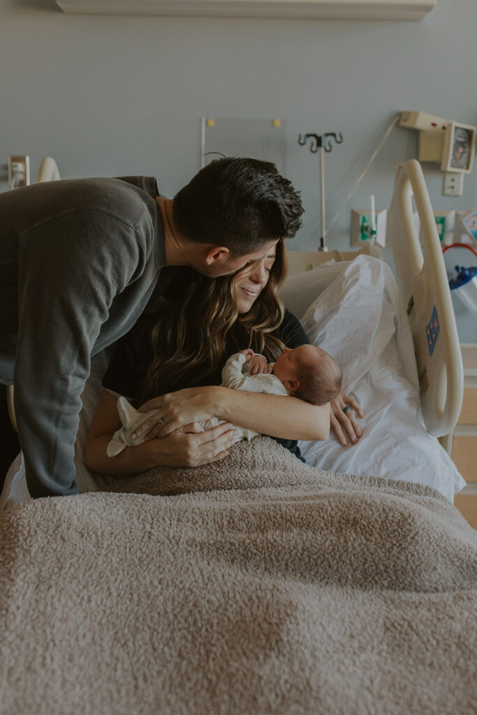 Mom and dad embrace their new baby boy and take in the first few moments with their precious son. Family parenting newborn core memory #fresh48 #GilbertAZnewbornphotography #newbornphotographer #chelseymichellephotography
 #siblingphotography
